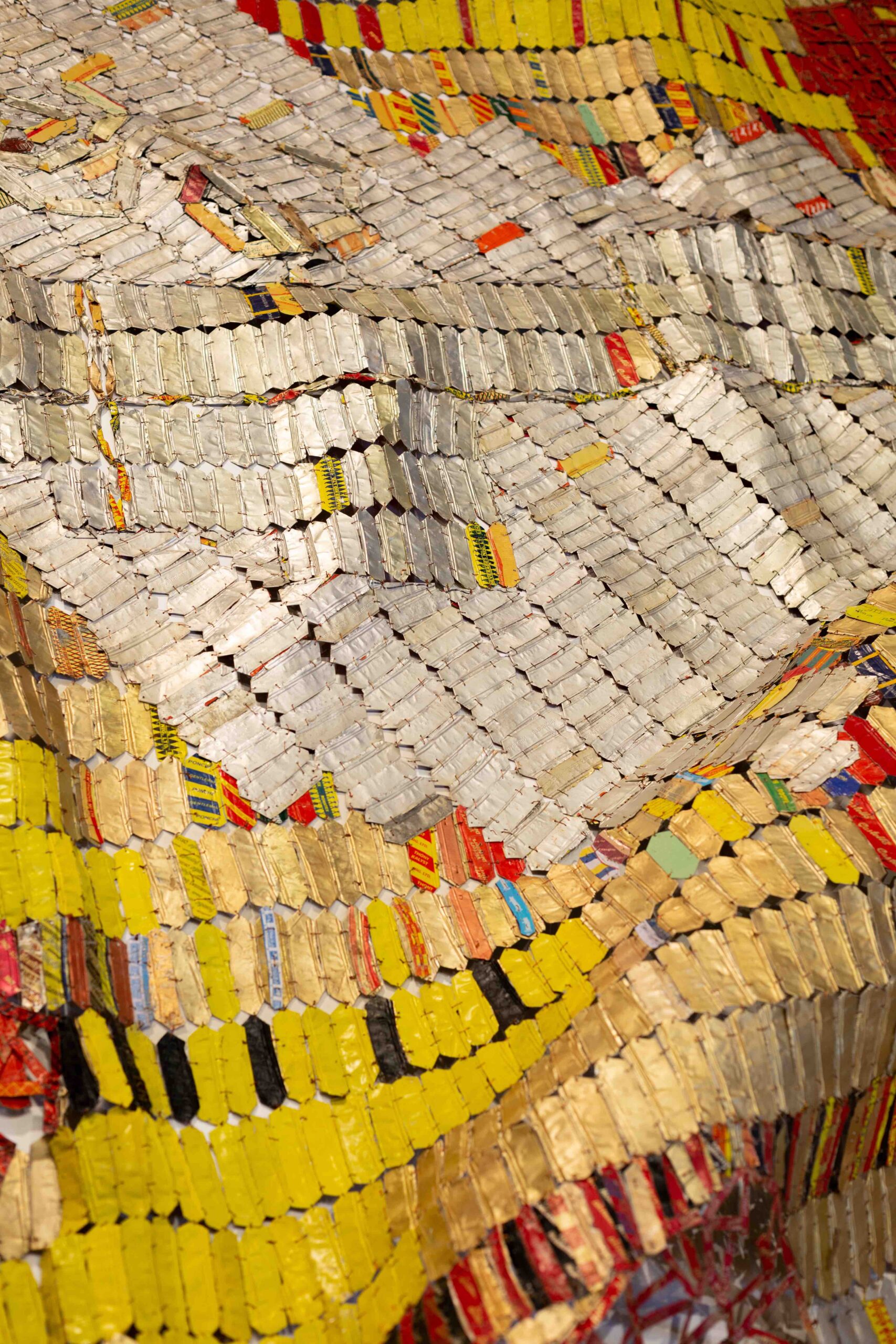 El Anatsui, (detail), 2021, aluminium and copper wire, 280 x 807cm- Courtesy the Artist and October Gallery, London